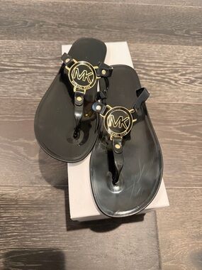 Michael Kors Black Jelly Thong Sandals with Gold MK Emblems